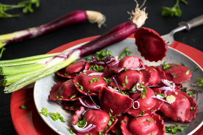 Close-up of red chili peppers on table