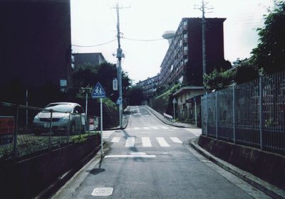 Road in city against sky