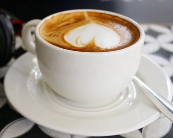 Close-up of cappuccino on table