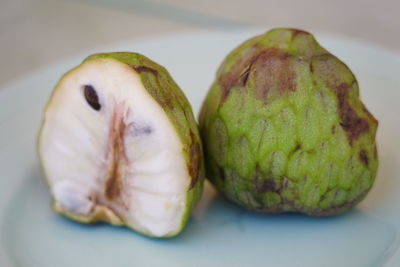 Close-up of sliced fruits on plate