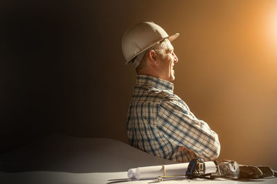 Man sitting against wall