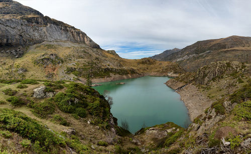 Scenic view of lake and mountains against sky