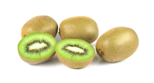 Close-up of fruits over white background