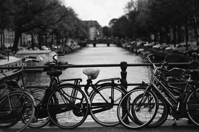 Bicycles on bridge over river in city