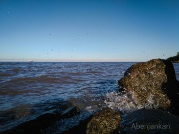 Scenic view of sea against clear sky