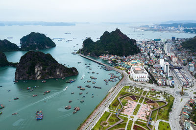High angle view of cityscape by sea
