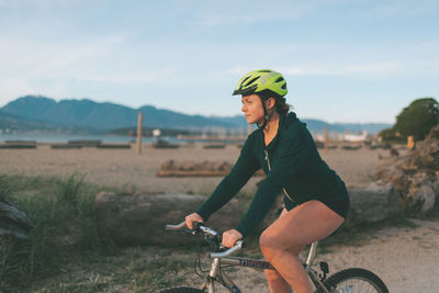 Man riding bicycle on field