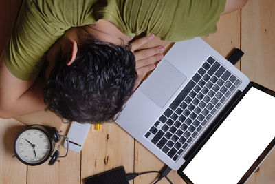 High angle view of man using mobile phone at home