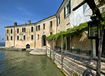 Canal amidst buildings in city