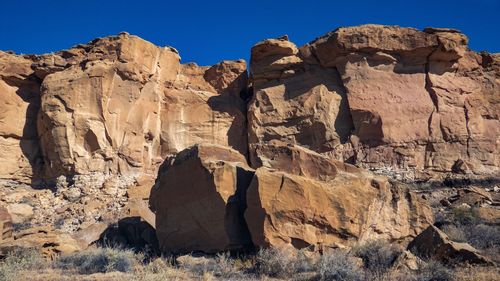 Rock formation on rocks against clear sky