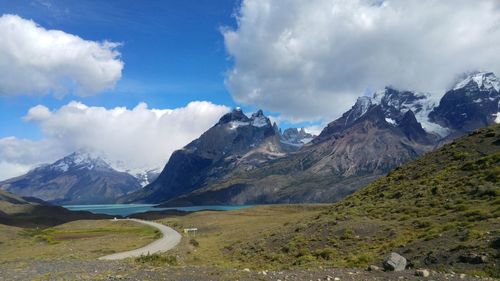 Scenic view of mountains against cloudy sky