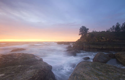 Scenic view of sea against sky during sunset