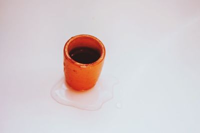 High angle view of coffee cup against white background