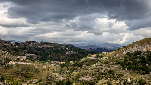 Panorama of the sicilian mountains under threatening clouds