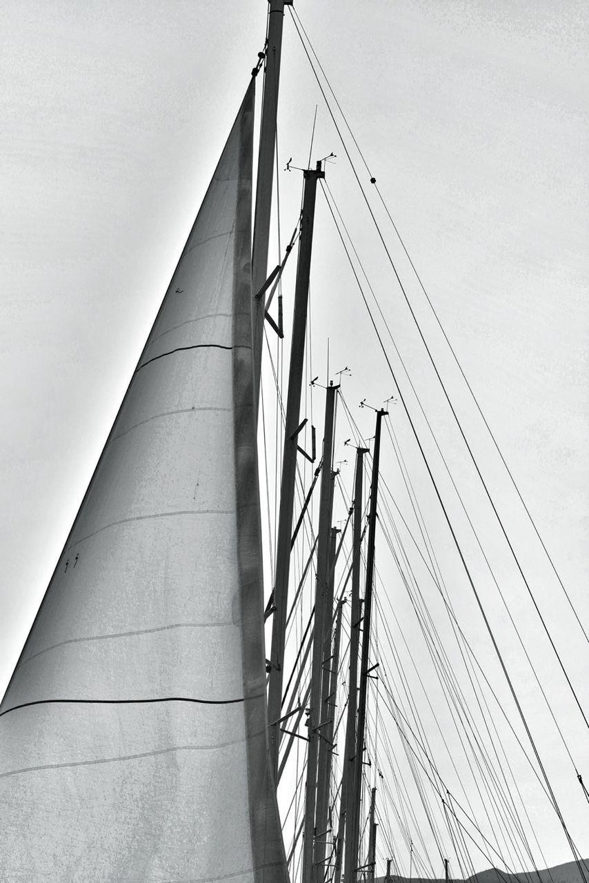 connection, low angle view, transportation, built structure, clear sky, cable, sky, architecture, mast, power line, suspension bridge, engineering, electricity pylon, day, bridge - man made structure, outdoors, no people, power supply, nautical vessel, electricity
