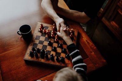 High angle view of man playing on table