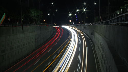 High angle view of light trails on road at night