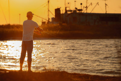 Full length of man standing in sea