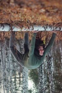 Upside down view of woman exercising on field 