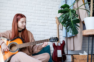 Young woman playing guitar