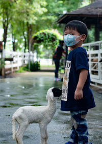 Full length of boy standing outdoors