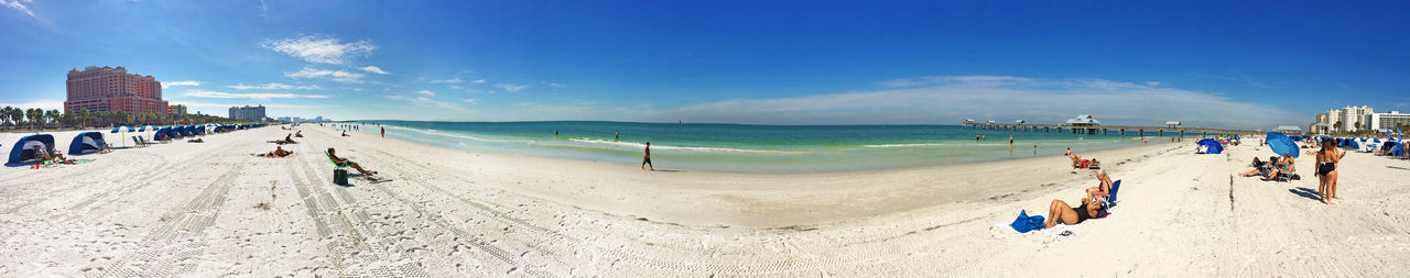 Panoramic view of beach against blue sky