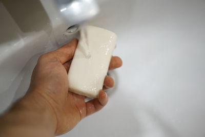 Close-up of hand holding ice cream