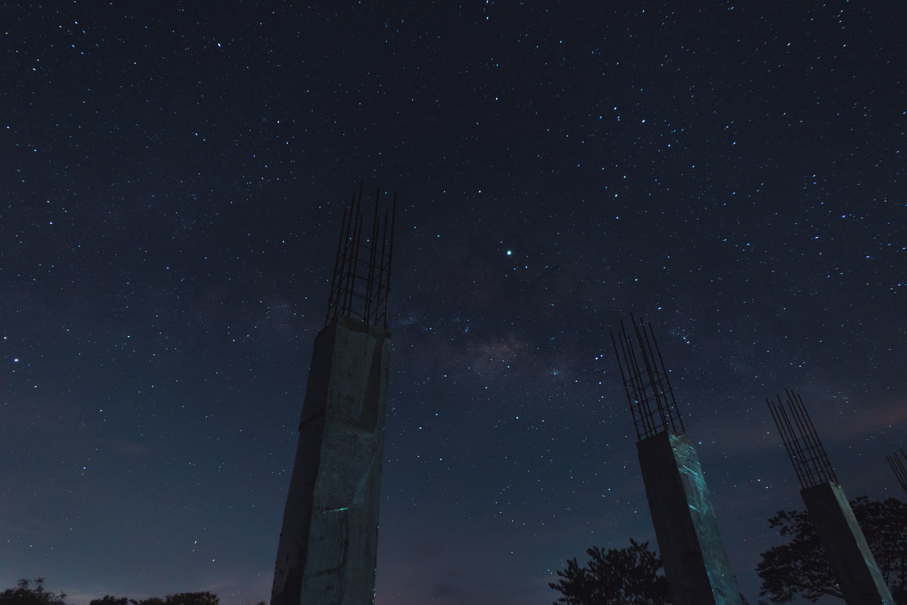 LOW ANGLE VIEW OF STARS AGAINST STAR FIELD AT NIGHT