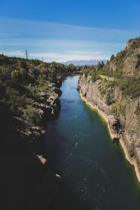 View of canal passing through landscape