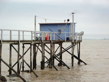 Pier over sea against sky