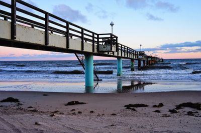 Pier over sea against sky