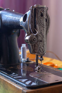 Close-up of machine part on table