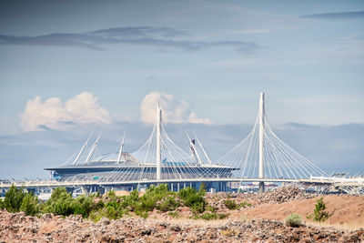 Low angle view of suspension bridge against sky