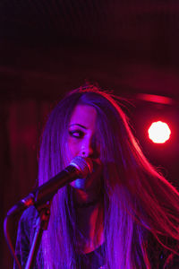 Thoughtful young woman with light painting