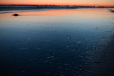 Scenic view of sea against sky at sunset