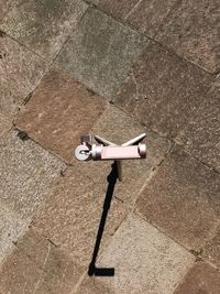 High angle view of umbrella on tiled floor