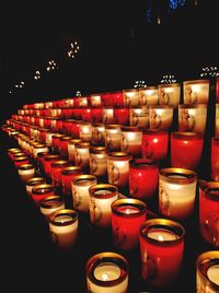 Close-up of illuminated candles in temple