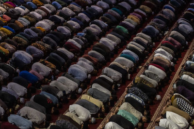 Muslim people praying at mosque first tarawih during month of ramadan