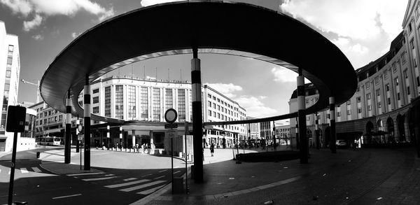 City street by buildings against sky