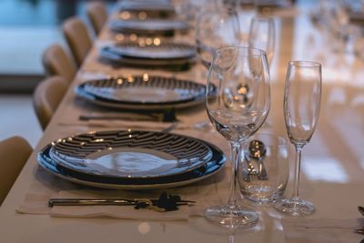 Close-up of wine glasses on table