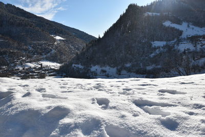 Scenic view of snowcapped mountains against sky