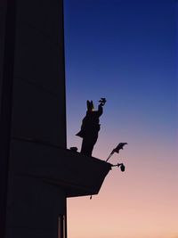 Low angle view of man standing on street
