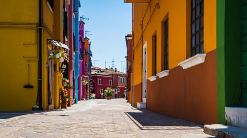 Narrow alley amidst residential buildings