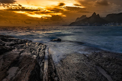 Scenic view of sea against sky at sunset