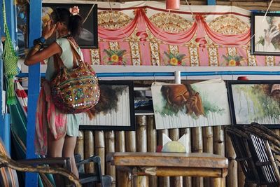 Woman standing at market stall