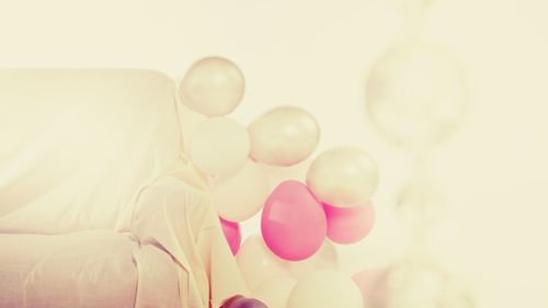 Low angle view of balloons against sky