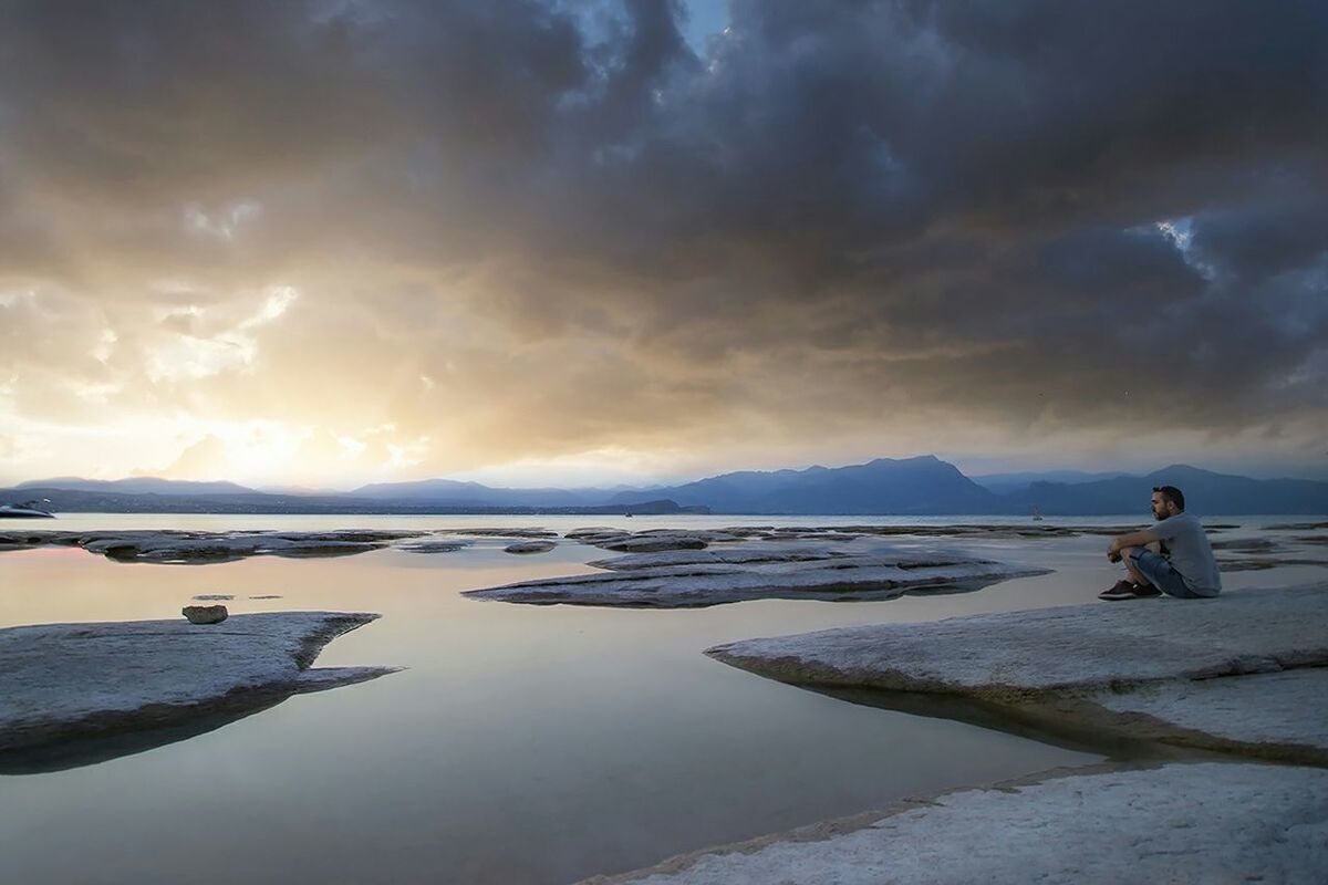 sky, water, cloud - sky, sea, beach, cloudy, shore, horizon over water, scenics, cloud, tranquility, beauty in nature, leisure activity, tranquil scene, weather, lifestyles, nature, sand