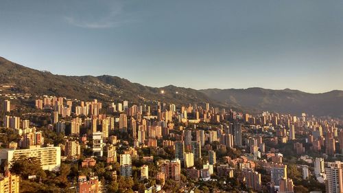 High angle view of buildings in city against clear sky