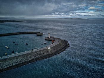 High angle view of sea against cloudy sky