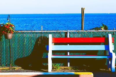 Built structure on beach against blue sky